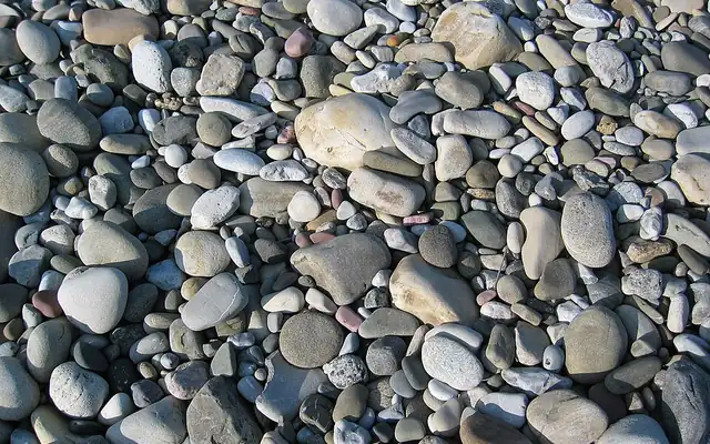 Smooth river rock pebbles in mixed gray tones